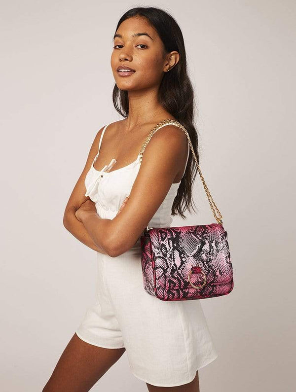 Skinnydip London | Roxy Pink Snake Cross Body Bag - Model Image 2