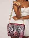 Skinnydip London | Roxy Pink Snake Cross Body Bag - Model Image 1