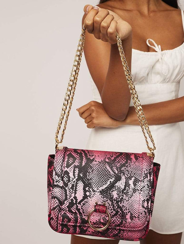 Skinnydip London | Roxy Pink Snake Cross Body Bag - Model Image 1