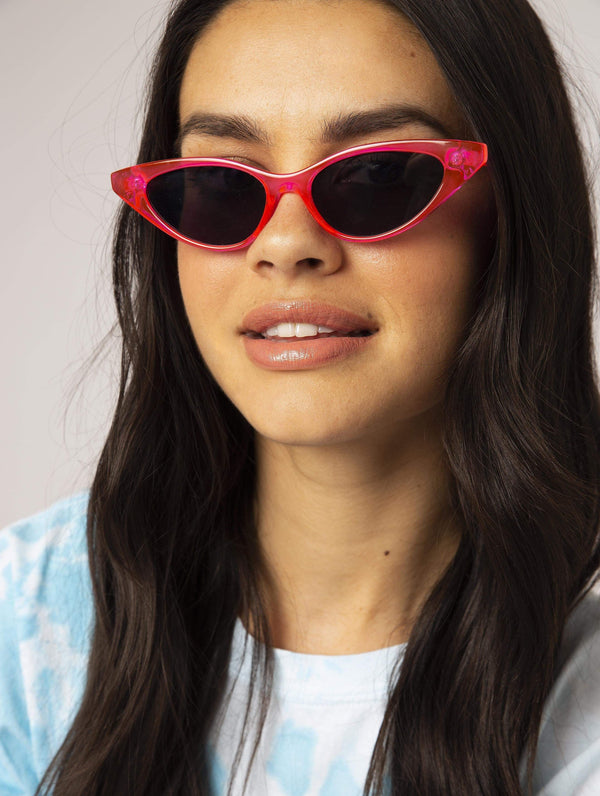 Skinnydip London | Neon Pink Cat Sunglasses - Model Image 1 