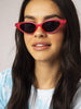 Skinnydip London | Neon Pink Cat Sunglasses - Model Image 1 