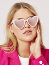 Skinnydip London | Pink Heart Sunglasses - Model Image