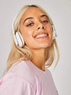 Skinnydip London | White Wireless Headphones - model image
