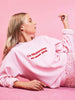 Skinnydip London | Mean Girls x Skinnydip On Wednesdays We Wear Pink Sweatshirt - Campaign Image 1