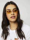 Skinnydip London | Yellow Frameless Sunglasses - Model Image 